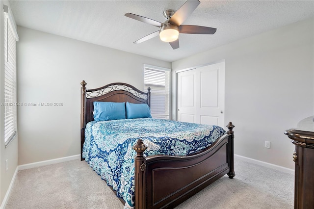 5720 Mentmore Dr, Mangonia Park, FL 33407 - carpeted bedroom with a closet, a ceiling fan, and a textured ceiling