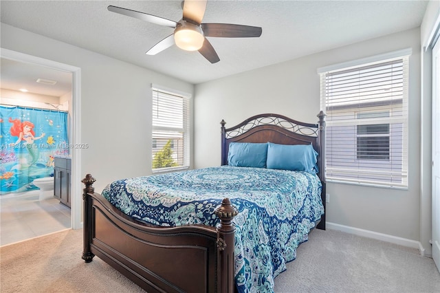 5720 Mentmore Dr, Mangonia Park, FL 33407 - carpeted bedroom with ensuite bath and ceiling fan
