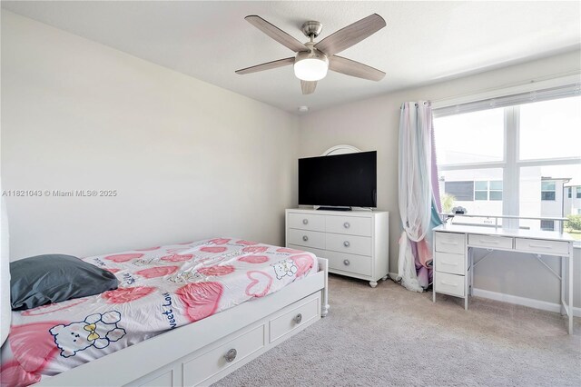 5720 Mentmore Dr, Mangonia Park, FL 33407 - bedroom featuring multiple windows, light colored carpet, and a ceiling fan