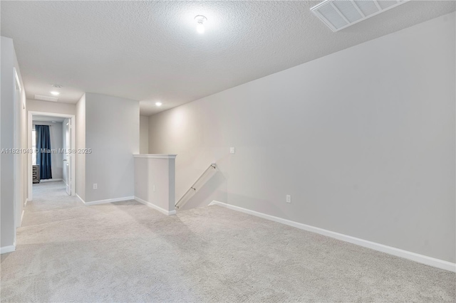 5720 Mentmore Dr, Mangonia Park, FL 33407 - empty room featuring light colored carpet and a textured ceiling