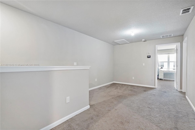 5720 Mentmore Dr, Mangonia Park, FL 33407 - carpeted empty room with baseboards and a textured ceiling
