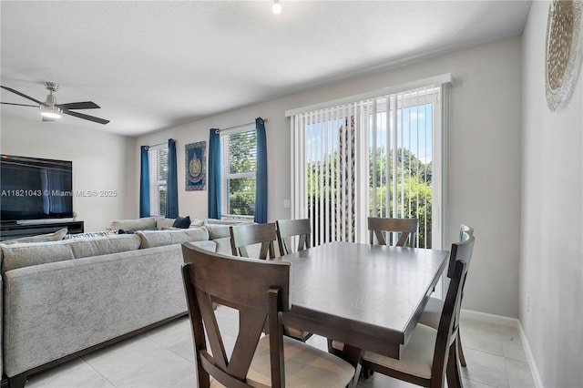 5720 Mentmore Dr, Mangonia Park, FL 33407 - dining space with light tile patterned floors and ceiling fan