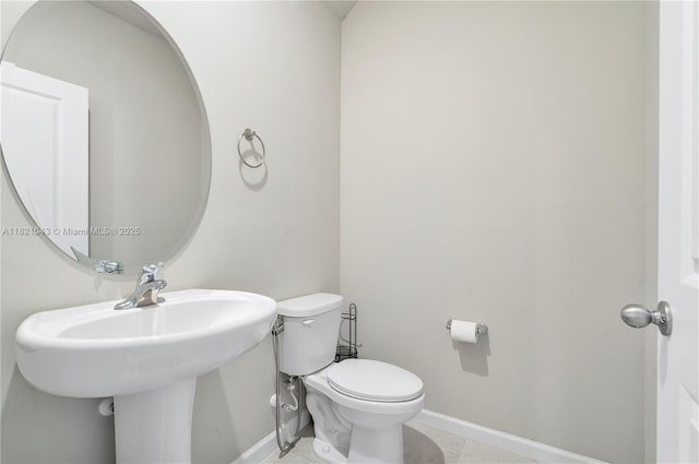 5720 Mentmore Dr, Mangonia Park, FL 33407 - half bath with baseboards and tile patterned flooring