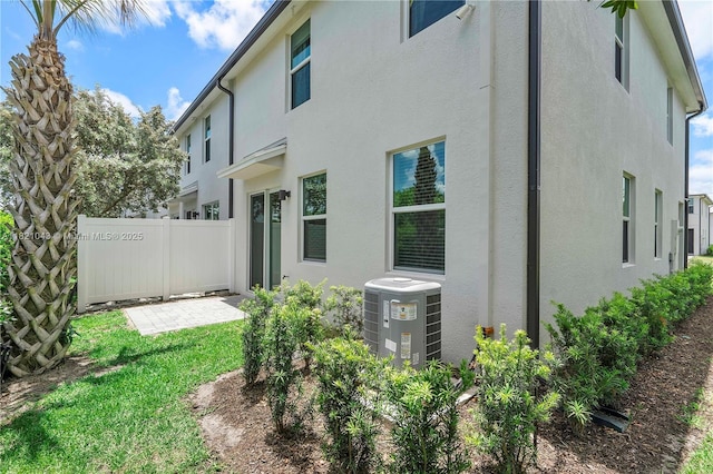 5720 Mentmore Dr, Mangonia Park, FL 33407 - rear view of property featuring stucco siding