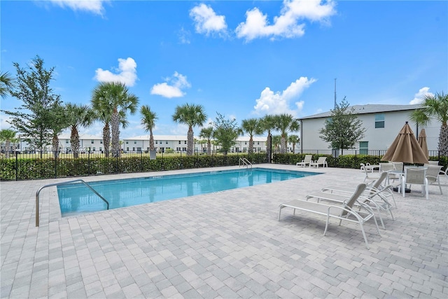 5720 Mentmore Dr, Mangonia Park, FL 33407 - community pool with a patio area