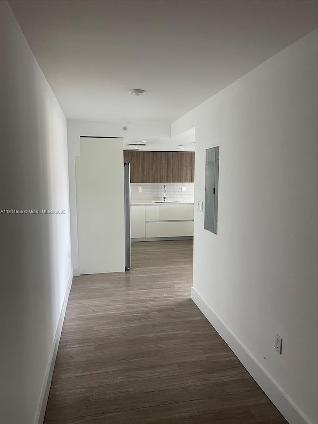 1025 92nd St Unit 607, Bay Harbor Islands, FL 33154 - corridor featuring electric panel and wood finished floors