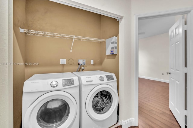 13227 SW 42nd St Unit 8103, Miramar, FL 33027 - washroom with wood finished floors and washing machine and clothes dryer