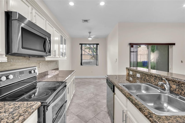 13227 SW 42nd St Unit 8103, Miramar, FL 33027 - kitchen featuring appliances with stainless steel finishes, white cabinets, tasteful backsplash, a ceiling fan, and recessed lighting