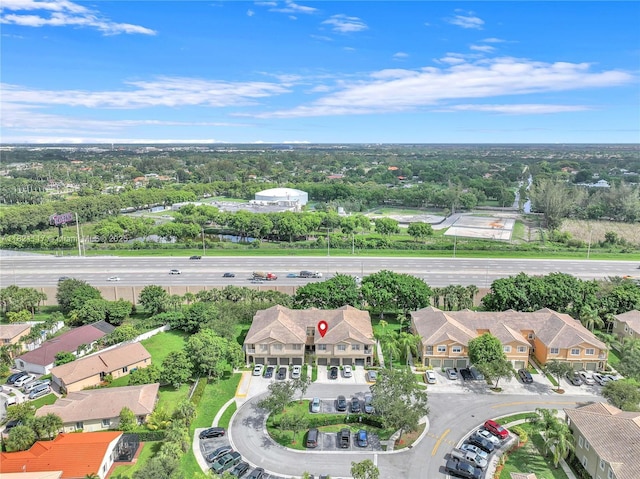 13227 SW 42nd St Unit 8103, Miramar, FL 33027 - aerial view of property and surrounding area featuring nearby suburban area and a tree filled landscape