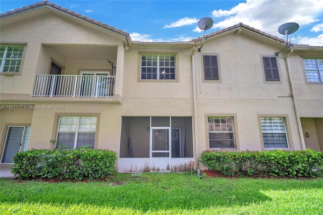 13227 SW 42nd St Unit 8103, Miramar, FL 33027 - back of property with stucco siding and a yard