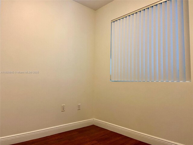 7275 SW 90th Way Unit 405, Miami, FL 33156 - unfurnished room with baseboards and dark wood finished floors