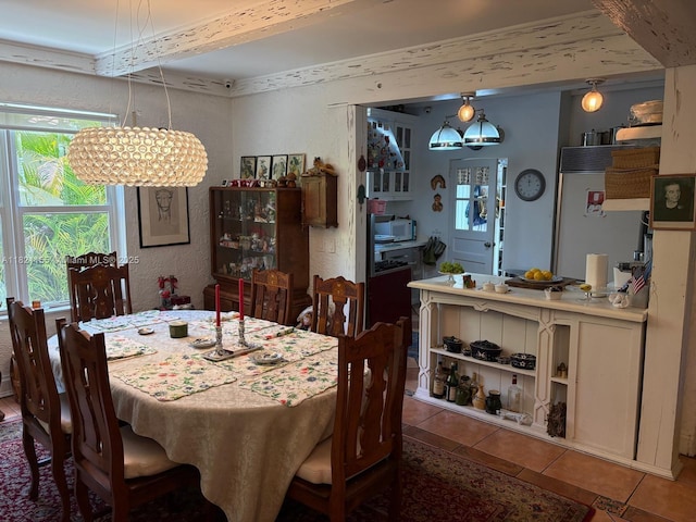 3767 Royal Palm Ave, Miami Beach, FL 33140 - dining area with a chandelier and tile patterned flooring