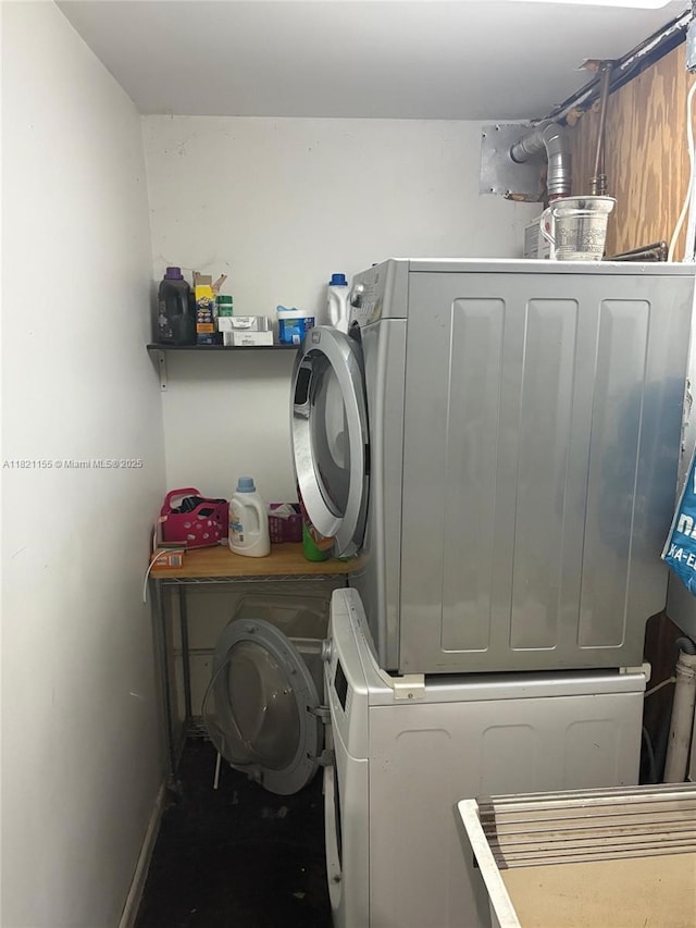 3767 Royal Palm Ave, Miami Beach, FL 33140 - washroom featuring stacked washing machine and dryer