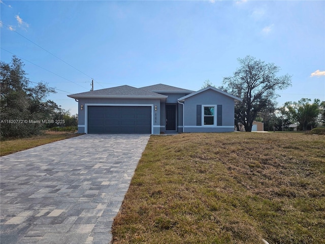 21475 Argosy Ave, Port Charlotte, FL 33954 - view of front facade with stucco siding, a garage, a front yard, and decorative driveway