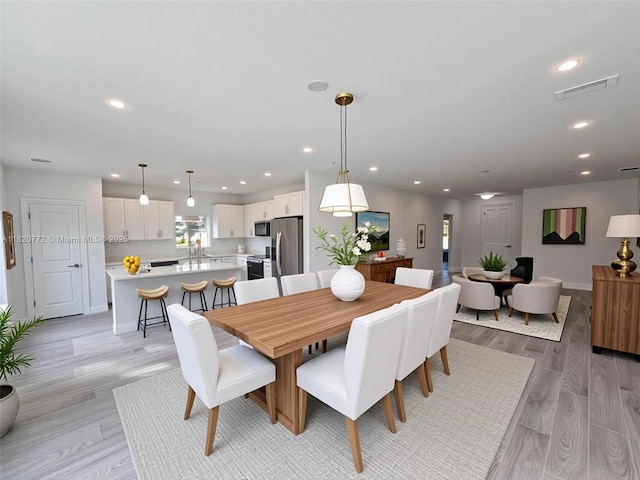 21475 Argosy Ave, Port Charlotte, FL 33954 - dining room featuring light wood-style floors and recessed lighting