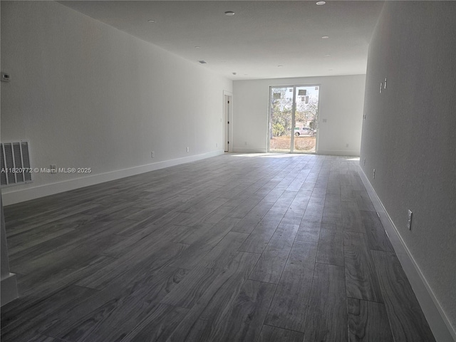 21475 Argosy Ave, Port Charlotte, FL 33954 - spare room with dark wood finished floors and baseboards