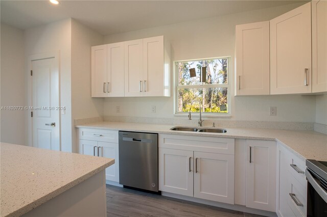 21475 Argosy Ave, Port Charlotte, FL 33954 - kitchen with dishwasher, white cabinetry, dark wood-style floors, recessed lighting, and light stone countertops