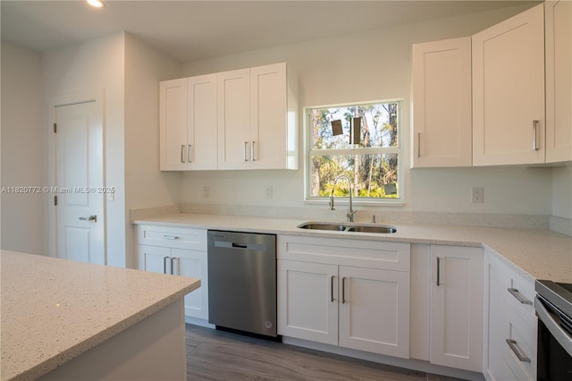 21475 Argosy Ave, Port Charlotte, FL 33954 - kitchen with dishwasher, white cabinets, dark wood-style floors, recessed lighting, and light stone countertops