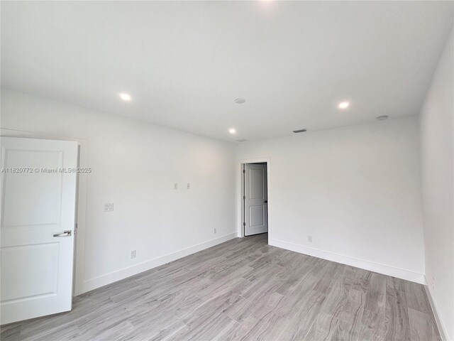 21475 Argosy Ave, Port Charlotte, FL 33954 - unfurnished room with light wood-style floors and recessed lighting