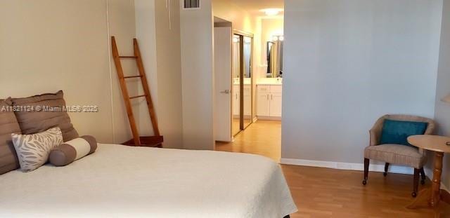3800 S Ocean Dr Unit 425, Hollywood, FL 33019 - bedroom featuring wood finished floors and connected bathroom