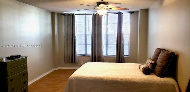 3800 S Ocean Dr Unit 425, Hollywood, FL 33019 - bedroom featuring wood finished floors and a ceiling fan