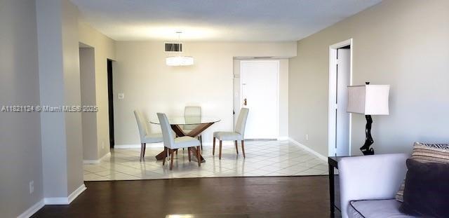 3800 S Ocean Dr Unit 425, Hollywood, FL 33019 - tiled dining space with baseboards