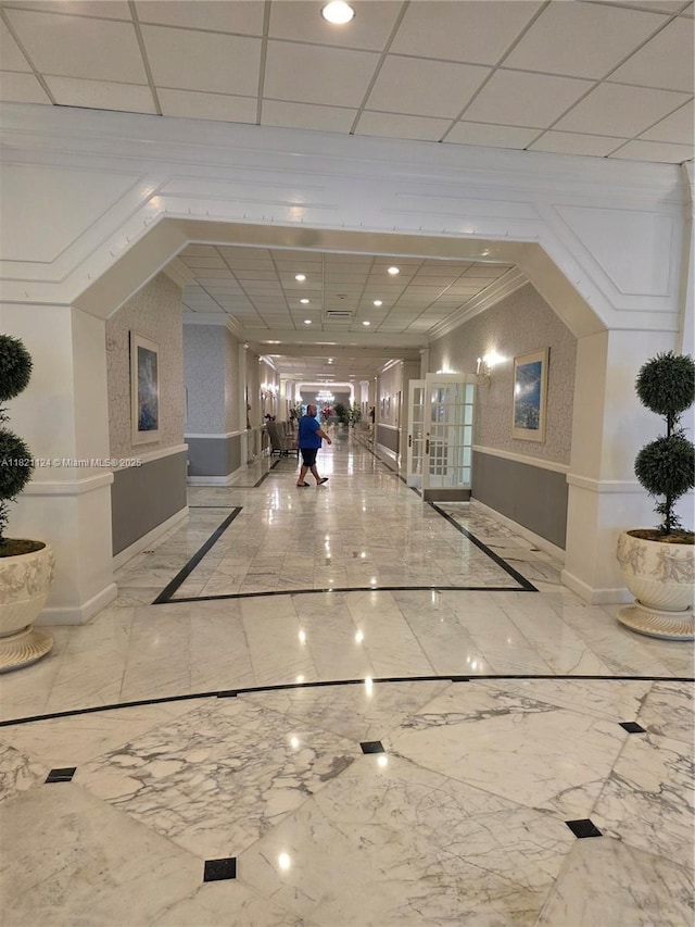 3800 S Ocean Dr Unit 425, Hollywood, FL 33019 - lobby featuring a wainscoted wall, crown molding, and a paneled ceiling