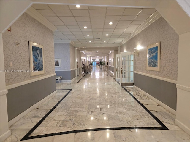 3800 S Ocean Dr Unit 425, Hollywood, FL 33019 - corridor featuring ornamental molding, french doors, marble tiled floors, recessed lighting, and inlaid floor details
