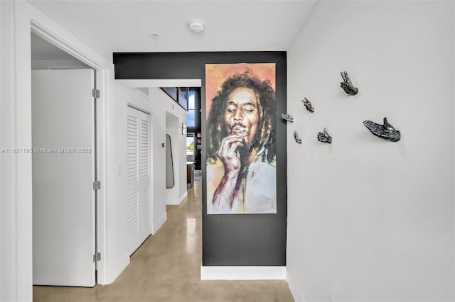 410 NE 36th St Unit 10, Oakland Park, FL 33334 - hall featuring concrete flooring and baseboards