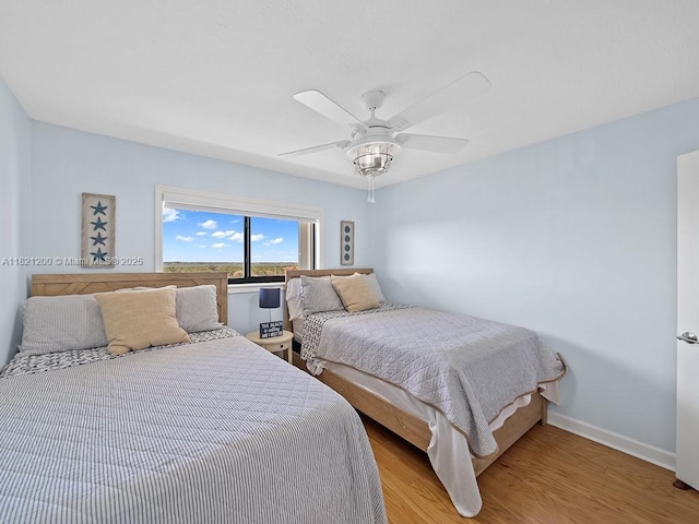 10152 S Ocean Dr Unit 618, Jensen Beach, FL 34957 - bedroom with light wood-style flooring and a ceiling fan