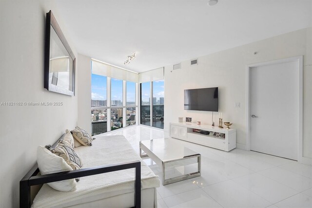 18201 Collins Ave Unit 2008, Sunny Isles Beach, FL 33160 - living room with floor to ceiling windows and light tile patterned floors
