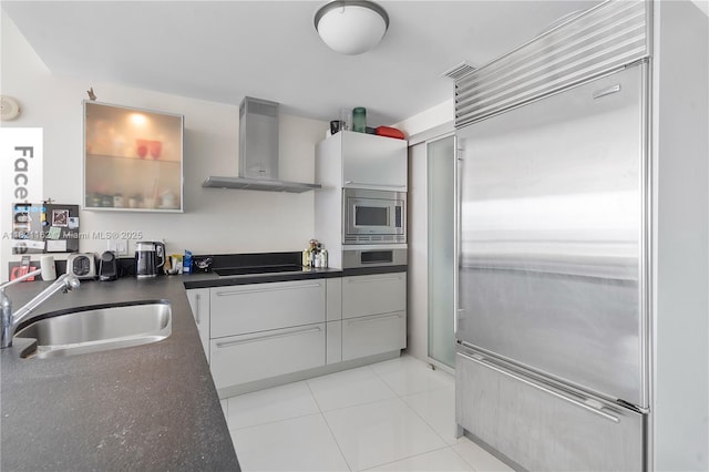 18201 Collins Ave Unit 2008, Sunny Isles Beach, FL 33160 - kitchen featuring built in appliances, ventilation hood, dark countertops, and modern cabinets