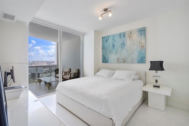 18201 Collins Ave Unit 2008, Sunny Isles Beach, FL 33160 - bedroom with a wall of windows, access to exterior, light tile patterned flooring, and a view of city