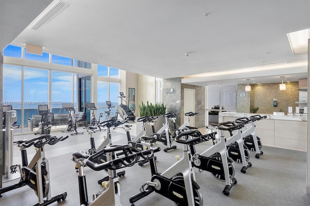 18201 Collins Ave Unit 2008, Sunny Isles Beach, FL 33160 - exercise room featuring expansive windows and a water view