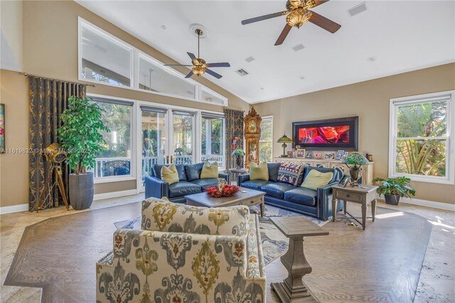 8755 Commodore Dr, Seminole, FL 33776 - living area with a ceiling fan and high vaulted ceiling