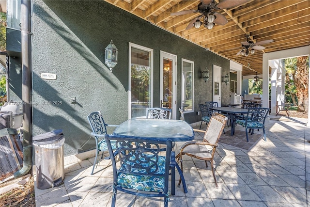 8755 Commodore Dr, Seminole, FL 33776 - view of patio / terrace featuring outdoor dining space and ceiling fan