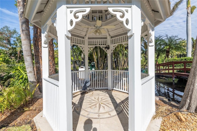 8755 Commodore Dr, Seminole, FL 33776 - view of patio / terrace with a gazebo, a water view, and ceiling fan