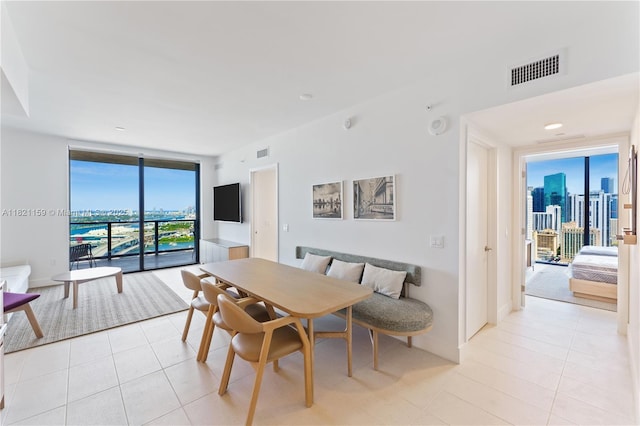159 NE 6th St Unit 3016, Miami, FL 33132 - dining room featuring expansive windows and light tile patterned floors
