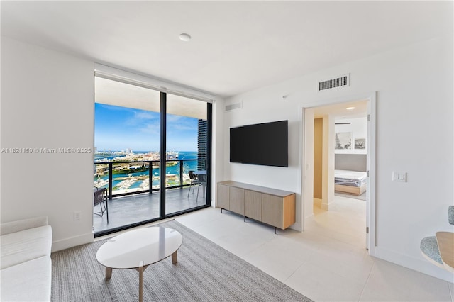 159 NE 6th St Unit 3016, Miami, FL 33132 - living area with a wall of windows and light tile patterned floors