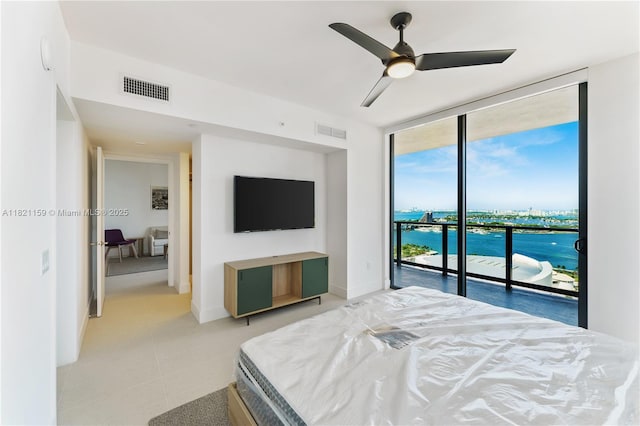 159 NE 6th St Unit 3016, Miami, FL 33132 - bedroom with floor to ceiling windows, access to outside, a ceiling fan, and light tile patterned floors