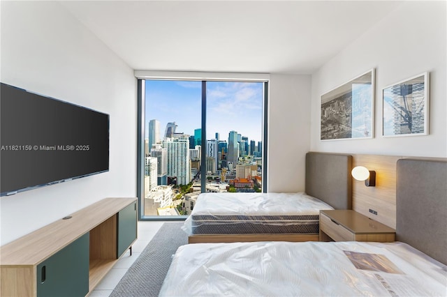 159 NE 6th St Unit 3016, Miami, FL 33132 - bedroom with a city view, light tile patterned floors, and floor to ceiling windows