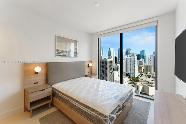 159 NE 6th St Unit 3016, Miami, FL 33132 - bedroom with light tile patterned floors and a wall of windows