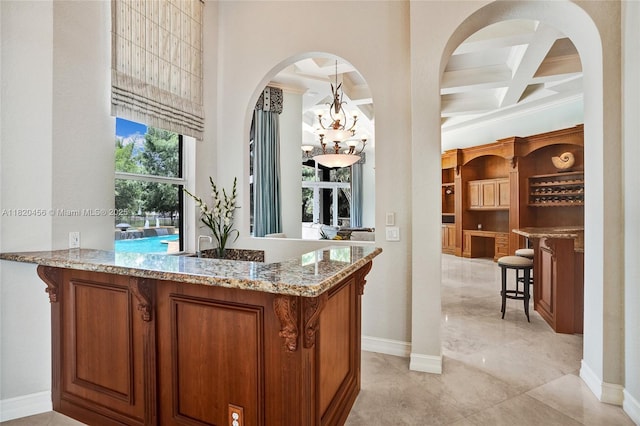 15093 SW 16th St, Davie, FL 33326 - bar with beamed ceiling, coffered ceiling, arched walkways, and a chandelier