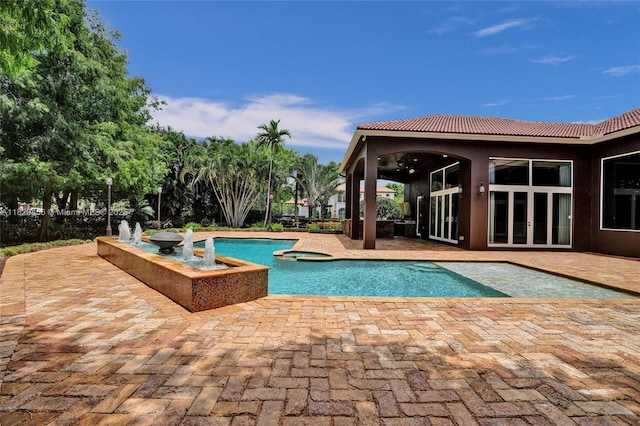 15093 SW 16th St, Davie, FL 33326 - view of pool featuring a patio, a pool with connected hot tub, and french doors