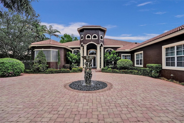 15093 SW 16th St, Davie, FL 33326 - view of front facade with curved driveway, stucco siding, and a tile roof
