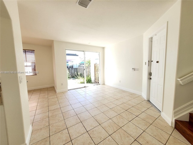 7633 NW 114th Path Unit 7633, Doral, FL 33178 - spare room with light tile patterned floors and healthy amount of natural light