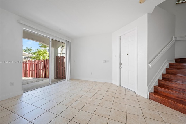 7633 NW 114th Path Unit 7633, Doral, FL 33178 - entrance foyer with light tile patterned flooring and stairs