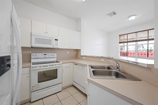 7633 NW 114th Path Unit 7633, Doral, FL 33178 - kitchen featuring white appliances, light countertops, white cabinets, and light tile patterned flooring