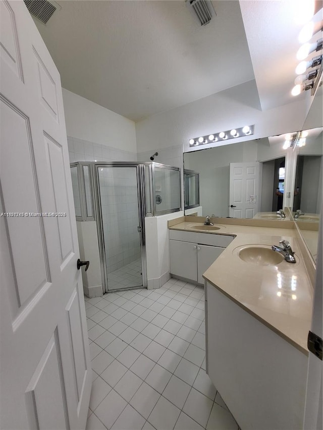 7633 NW 114th Path Unit 7633, Doral, FL 33178 - bathroom with a stall shower, tile patterned flooring, and vanity