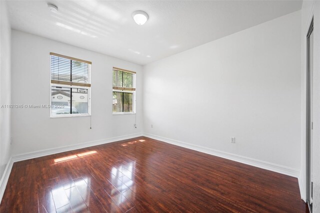 7633 NW 114th Path Unit 7633, Doral, FL 33178 - spare room featuring a smoke detector and wood finished floors
